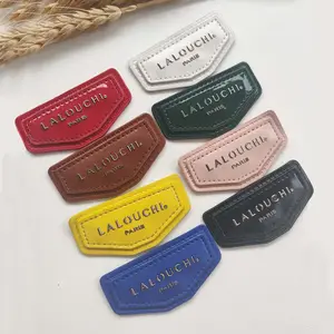 Wholesale of high-quality glossy patent leather inlaid with letter metal badge patches by manufacturers