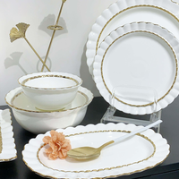 Service de table en céramique et porcelaine de luxe blanc avec bordure dorée, écologique et étanche, idéal pour les cadeaux de mariage, vente en gros