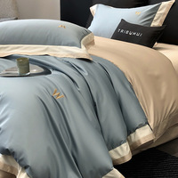 Parure de lit de luxe haut de gamme 100S double épaisseur personnalisable quatre pièces avec broderie simple, housse de couette et drap-housse