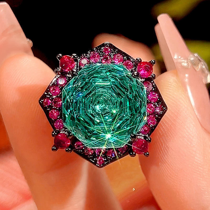 Bague ouverte en or noir et perle verte