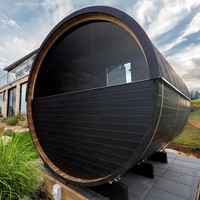 HELIUS Schwarze Moderne Outdoor-Fass-Sauna Maßgefertigte Installation 4-Personen-Dampfsauna Heizung Gecko-Steuerung