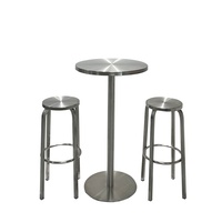 Table de bar et tabouret haut en acier inoxydable, style industriel moderne, pour usage commercial, idéal pour les bars et bistrots branchés.