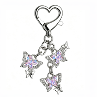 Porte-clés papillon orné de strass brillants avec mousqueton en forme de cœur pour la décoration des sacs à main et des sacs quotidiens