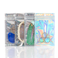 Pochette holographique transparente refermable avec trou de suspension et trois soudures latérales pour l'emballage de bonbons, snacks et aliments gélifiés