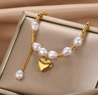 Bracelet pour femme en acier inoxydable avec pendentif cœur, chaîne dorée style Miami et perles d'imitation – Idéal pour un anniversaire