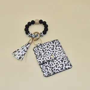Bracelet porte-clés en perles de silicone avec motif de vache Porte-cartes Bracelet porte-clés élastique pour femmes