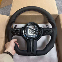 Volant en cuir noir en gros pour BMW E87 E83 E90 E91 E92 E84 X1 X5 X6 E70 E71 M3 M5 F10 F20 F22 F23 F30 F33 325i 550i
