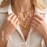 Collier tendance transfrontalier en acier inoxydable plaqué or avec pendentifs multiples étoile de mer et perles imitation émail, chaîne en bambou