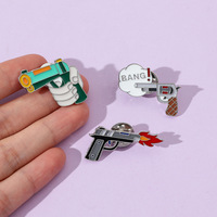 Bros pistol kepribadian kreatif kartun grosir lencana logam berbentuk pistol lucu aksesori pakaian pin enamel