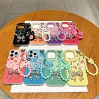 Coque de téléphone de luxe créative en élastomère thermoplastique, motif nœud floral, ornée de diamants et de perles, avec sangle chaîne pulvérisée
