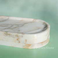 Plateau ovale de luxe en marbre de style minimaliste moderne pour l'organisation de parfums et la décoration de coiffeuse, également idéal comme assiette à fruits ou pour la table.