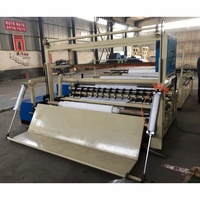 Machine automatique de découpe et de rembobinage de papier en maxi-rouleaux et en petites bobines