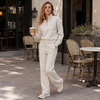 Conjunto de dos piezas OEM ODM para mujer: Sudadera de algodón tipo avena con cremallera de un cuarto y pantalones de chándal de cintura alta de pierna ancha estilo streetwear.