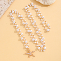 Collier de perles multi-brins avec pendentif étoile de mer dorée, bijou classique élégant à superpositions, cadeau pour femme