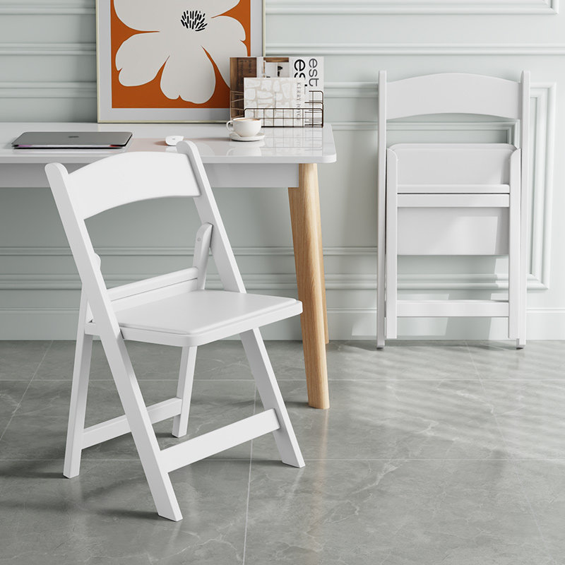White upholstered folding chair with reinforced seat