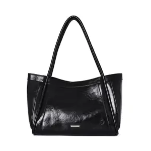 Bolso de mano de cuero PU de moda para mujer Diseño de nicho Bolso femenino impermeable negro