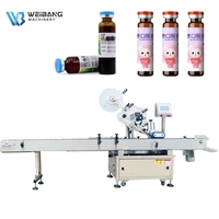 Machine d'étiquetage automatique horizontale pour bouteilles rondes, flacons de liquides oraux, ampoules, tubes de réactifs et rouges à lèvres