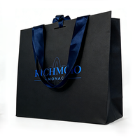 Sacs en papier noir de luxe pour cadeaux, emballages de vêtements, sacs de shopping européens biodégradables et recyclables pour les petites entreprises