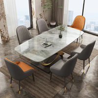 Table à manger rectangulaire de luxe avec plateau en pierre frittée et base en métal doré