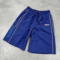 Shorts de sport pour hommes personnalisés avec logo, légers, à séchage rapide, en nylon, avec détails de passepoil, coupe large, décontractés, vente en gros