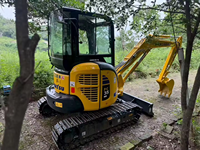 Mini-excavatrice sur chenilles Komatsu PC35 3T d'occasion avec moteur et système hydraulique fiables, idéale pour la construction urbaine et l'aménagement paysager
