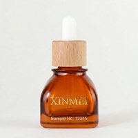 Flacon en verre plat ambré de haute qualité 30 ml avec anneau en bambou et compte-gouttes pour huile essentielle, sérum, cosmétique, vide, personnalisable, avec carton