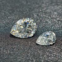 Vente en gros usine de pierres brutes de moissanite blanches de qualité VVS, de forme poire, créées en laboratoire, à effet chromatique, dureté 9.25 Mohs, pour la joaillerie