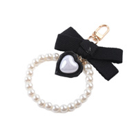 Hot Selling Kreative Seidenband Bogen Knoten Perle Quaste Harz Schlüssel ring Perle Bogen Schlüssel bund für Frauen und Mädchen