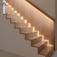 Escalier droit pour intérieur, structure en acier carbone robuste, balustrade en verre pour projet de logement