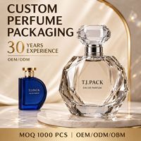 Flacon de parfum en cristal transparent multi-facettes avec bouchon en diamant et ensemble de mini-flacons bleus pour l'emballage de parfums de luxe