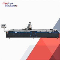 Machine de vissage automatique à double tête et double plateforme pour la fabrication de fenêtres et de portes en PVC et UPVC