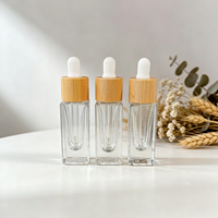 Vente en gros de flacons compte-gouttes en verre épais de luxe de 5 ml, flacons vides pour sérum avec col en bambou pour les soins de la peau, les parfums et les huiles essentielles