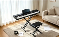 Piano numérique 88 touches lestées, finition PVC imitation bois, alimentation 5V, prise casque pour sortie MIDI, idéal pour débutants