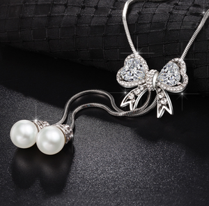 สร้อยคอแฟชั่นผู้หญิงแบบใหม่ ดีไซน์โบว์โลหะผสมประดับคริสตัล พร้อมสายโซ่ไม้ไผ่ยาว จี้พู่ห้อย เรียบง่าย - Product Image 6