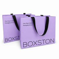 Sacs shopping en papier de luxe avec logo personnalisé et poignées pour l'emballage de vêtements, sacs cadeaux en gros