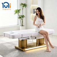 Lit de massage électrique à LED de conception nouvelle, 3/4 moteurs, base réglable à double cylindre dorée, pour clinique de soins de la peau