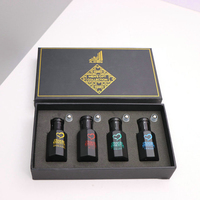 Boîte de parfum en carton noir de haute qualité avec revêtement en éponge de logo d'estampage en or chaud laminage mat et gaufrage manipulé