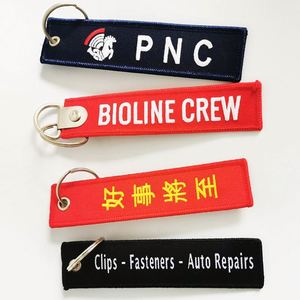 Wholesale Customized Remove Luggage Tag Label Before Embroidery Keyring Flight for logo Woven Keychains - Product Image 3