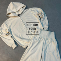 Survêtement unisexe blanc vintage délavé et vieilli, coupe oversize, avec logo personnalisé imprimé ou brodé, et sweats à capuche zippés assortis