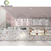 Ensemble de mobilier de restaurant commercial moderne rose, comptoir de service en marbre, table et chaise en bois durable pour les cafés