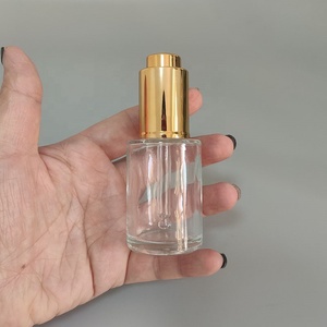 Vente en gros de flacon compte-gouttes de sérum d'huile essentielle en verre transparent givré à bouton-pression en forme de cylindre rond à épaulement plat de 1oz 30ml - Product Image 5