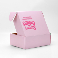 Boîte d'emballage rose avec un imprimé ondulé vibrant, boîtes d'emballage et d'expédition en carton pour les produits de boulangerie et les friandises