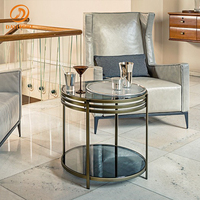 Table basse ronde à double niveau avec rangement, plateau en verre trempé noir et structure circulaire en acier inoxydable, style contemporain