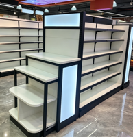 Étagères de présentation pour supermarchés, système de rayonnage métallique LED pour magasins de maquillage et cosmétiques, étagères blanches à niveaux avec embouts.