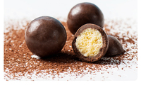 Chocolat composé sucré Mylikes, boule de chocolat au lait avec centre croustillant et bonbons éclatants Mylikes