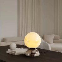 Lampe de table en marbre transfrontalière pour chambre à coucher, style luxe léger haut de gamme, nouvelle lumière d'ambiance en jade style Bulgari pour la pièce.