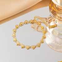 Parure de bijoux fantaisie de luxe étanche en acier inoxydable plaqué or 18 carats avec collier et bracelet en forme de cœur pour femme, vente en gros