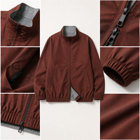 Veste coupe-vent réversible pour homme en tissu technique, col montant, fermeture éclair bidirectionnelle, intérieur contrastant, coupe-vent, style bomber