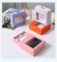 Boîte à bijoux A1 mate pastel avec tiroir coulissant, fenêtre transparente supérieure, tirette à ruban et insert en mousse rembourrée