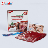 Kit profesional de tiras secas para blanquear los dientes con peróxido de aceite de coco con logotipo personalizado de 28 piezas
